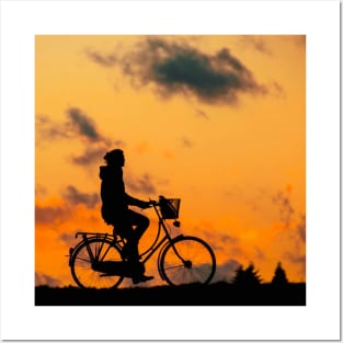 biking in the sunset Posters and Art